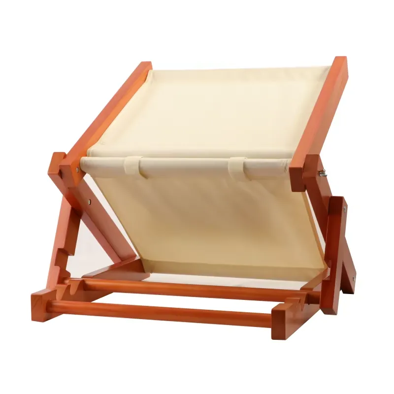 Folding wooden lounger with cream canvas seat and orange-brown frame, angled view