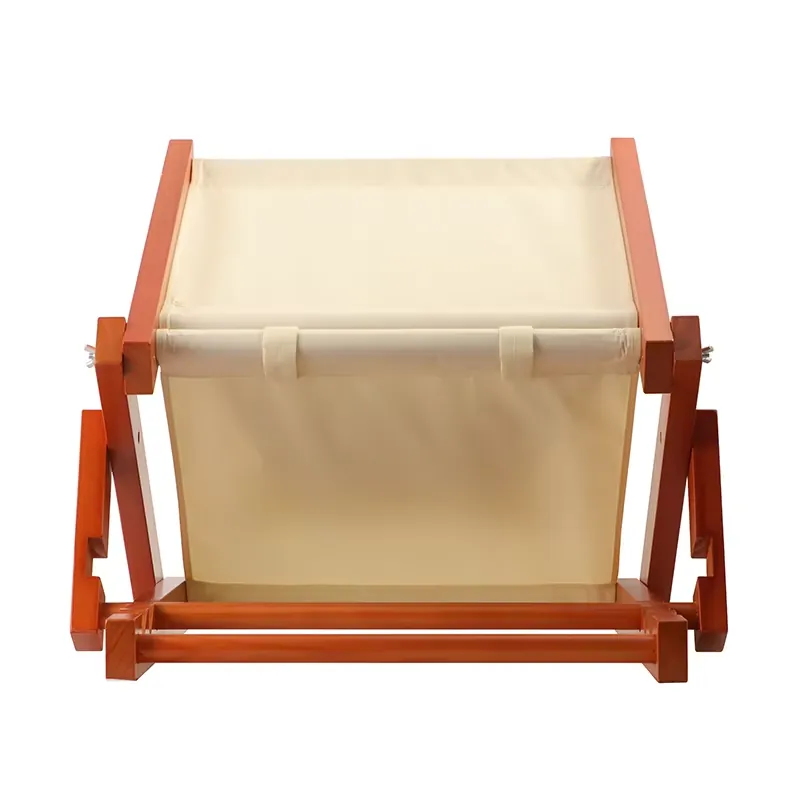 Front view of folding wooden beach chair with cream canvas sling