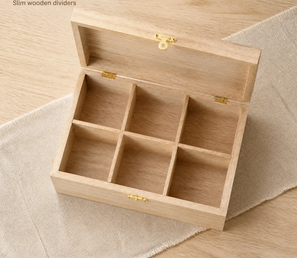 Wooden compartment box with hinged lid open on a linen cloth