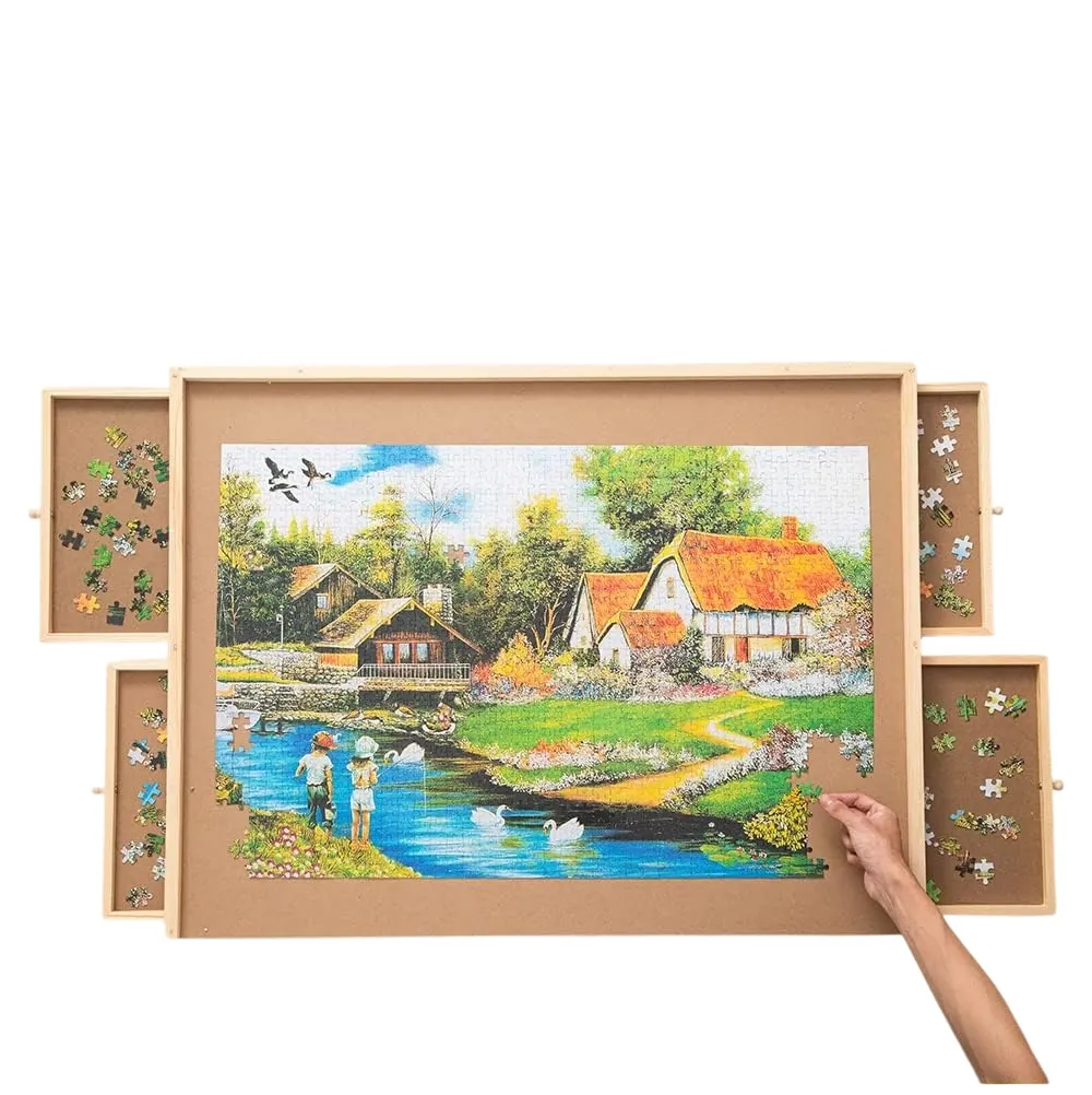 Wooden puzzle board with four sliding drawers holding puzzle pieces and a completed cottage-scene puzzle