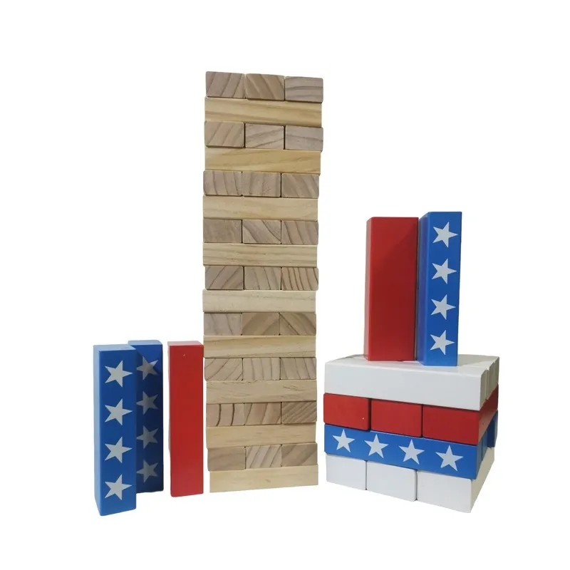 Tall natural pine tumbling tower with red, white and blue star-printed blocks beside it