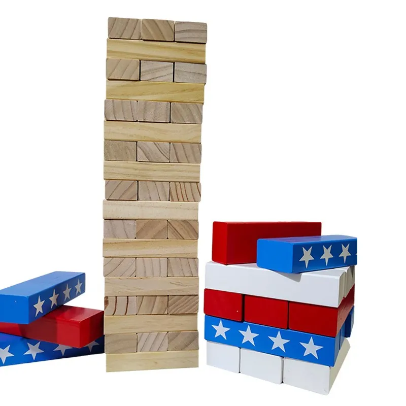 Giant wooden stacking block tower with star-print blocks stacked in front